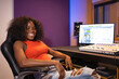 © ADDICTIVE STOCK - Content black woman with computer recording sound