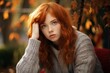 © Jorge Ferreiro - beautiful young red-haired woman serious and thoughtful