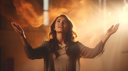 Christian worship and praise, a young woman with her arms raised