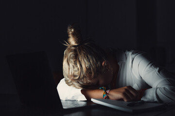 Tired teen girl caucasian university student fall asleep exhausted after difficult learn exam test, deprived lazy young woman sleeping sit at desk feel fatigue having nap dozing bored of study concept