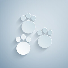 Canvas Print - Paper cut Paw print icon isolated on grey background. Dog or cat paw print. Animal track. Paper art style. Vector