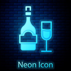 Poster - Glowing neon Champagne bottle with glass icon isolated on brick wall background. Vector