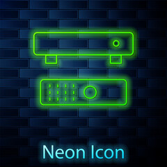 Poster - Glowing neon Multimedia and TV box receiver and player with remote controller icon isolated on brick wall background. Vector