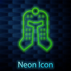 Poster - Glowing neon line Medieval iron helmet for head protection icon isolated on brick wall background. Vector