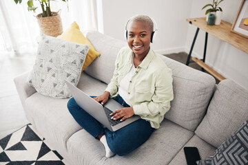 Sticker - Portrait of black woman, remote work or laptop on sofa in living room for online research in headphones. Happy, top view or journalist working on computer for streaming or social media blog at home