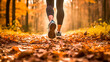 Athlete woman running in her sneakers trough the forest in autumn. Female jogging in running shoes closeup. Outdoor recreational training and active lifestyle	