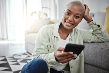 Poster - Woman, portrait and typing on smartphone on living room floor for social media post, search contact or download mobile games. Happy african person, cellphone and subscription on digital app at home