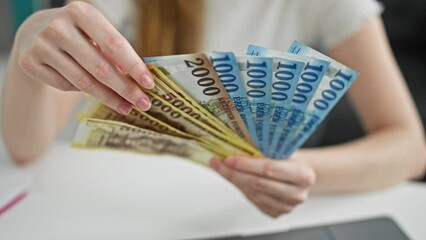 Poster - Young blonde woman business worker holding hungary forint banknotes at the office