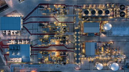 Wall Mural - Aerial view power plant for oil refinery petrochemical industrial, Oil  refinery factory power plant at night and pipeline steel, Oil refinery factory and power plant.