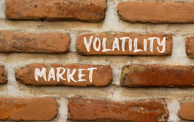 Market volatility symbol. Concept words Market volatility on beautiful brick wall. Beautiful red brown brick wall background. Business market volatility concept. Copy space.