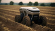 Close-up of autonomous futuristic agricultural robot tractor on tilled field. Concept of farming automation, smart agri-tech, enhanced efficiency and wireless innovations in agriculture, 5G technology
