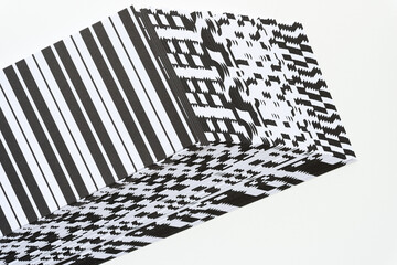 Canvas Print - optical illusion 3d paper shape (cube or box) composed with pile of black and white paper sheets arranged in staggered form