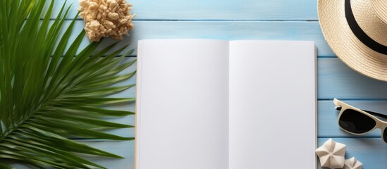 Aufkleber - A summer themed blank book for writing with beach accessories in the background Flat lay with copy space