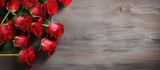 Poster - Copy space image with red roses flowers on gray wooden table for greeting card