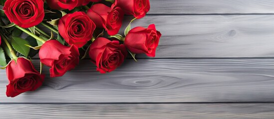 Poster - Copy space image with red roses flowers on gray wooden table for greeting card