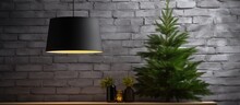 Minimalist Black Industrial Loft Style Lampshade Adorned With Spruce Branches Against A White Brick Wall Creating A Close Up Christmas And New Year Ambiance