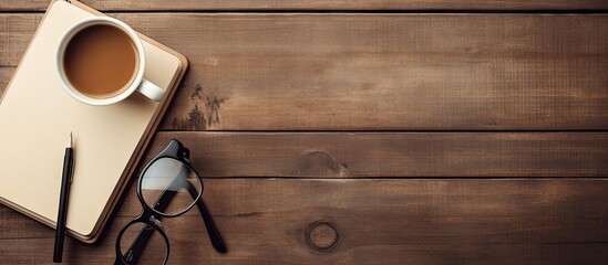 Poster - Retro camera coffee cup notepad and glasses arranged on a wooden table from a top viewpoint