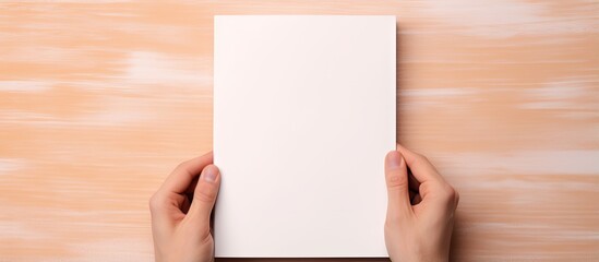 Poster - Top down view of hands holding an open notepad