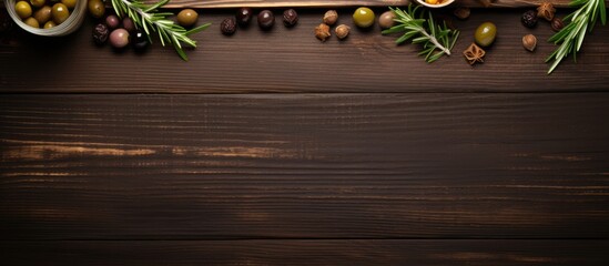 Poster - Top down view of tasty pickled capers and rosemary twigs on a wooden table leaving room for text