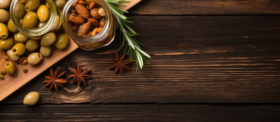 Poster - Top down view of tasty pickled capers and rosemary twigs on a wooden table leaving room for text