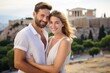 © Anne Schaum - Couple in their 30s smiling in front of the Acropolis in Athens Greece