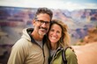 © Anne Schaum - Couple in their 40s smiling at the Grand Canyon in Arizona USA
