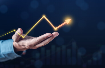 Business Chart Arrow Glowing on Stock market Analysis Data and Trading statistic value economic on hand index fund and money exchange business technology concept.