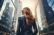 Back view of a young Scandinavian businesswoman in a formal suit against the backdrop of skyscrapers in the business district of the city. Success and prosperity. Hard work in finance.