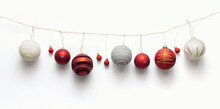 Various Christmas Balls On A Rope On A White Background Top View. Creative Winter Holidays, New Year  Background