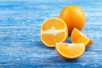 Wall Mural - slices of oranges on a wooden table