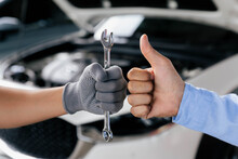 Mechanics Is Holding A Spanner While The Other Is Showing Thumb Up, Technic Occupation. Automobile Repair Service Concept.