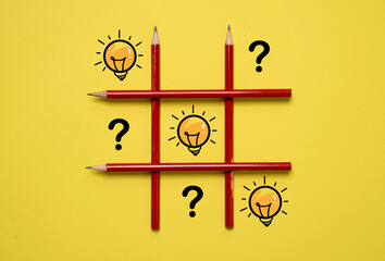 Poster - glowing drawing lightbulb and question mark on tic tac toe table for creative thinking innovation idea and problem soling solution concept.