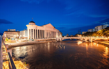 Vardar river. Exciting  cityscape of capital of North Macedonia - Skopje with Archaeological Museum.  Main square