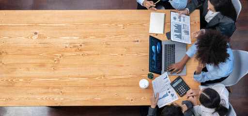 Wall Mural - Panorama top view multiracial analyst team use BI dashboard display on laptop screen, analyzing financial data for strategic decision. Fintech analyzes marketing indicators. Concord