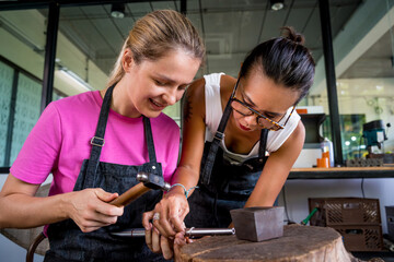 Poster - Teacher jeweler and student make jewelry in workshop