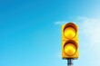 Yellow traffic light with Clipping Path in blue sky