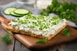 Cottage Cheese and parsley on white wooden board with homemade Crispbread toast