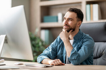 Aufkleber - Handsome Male Entrepreneur Sitting At Workplace With Thoughtful Face Expression