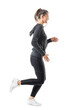 © sharplaninac - Happy smiling female jogger running in zip up hooded sweatshirt and leggings. Side view. Full body length isolated on transparent background.