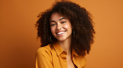 happy woman smiling on an orange background