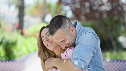 Poster - Man and woman couple hugging each other kissing at park