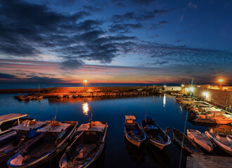 Wall Mural - Evening dusk in Gallipoli, province of Lecce, Puglia, southern Italy.  View from walls of Angevine-Aragonese medieval Castle fortress