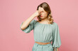 © ViDi Studio - Young sick ill tired sad preoccupied frustrated woman she wearing casual clothes keep eyes closed rub put hand on nose isolated on plain pastel light pink background studio portrait Lifestyle concept