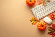 Autumn Office Workspace. Autumn Flat Lay Background. Keyboard, Laptop With Autumn Cloth And Fall Decorations - Pumpkin, Leaves And Other.