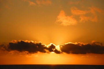 Perfect sunset over the sea with the sun seen as red circle. Corsica island.