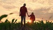 Dad daughter hold hands in field. Father, child walk on field, sunset. Kid girl, dad go hand in hand, field corn sprouts. Family farming business. Agricultural industry. Growing corn, organic food