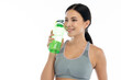 © Art_Photo - Portrait sport beauty body slim woman drinking water from a bottle while relax and feeling fresh on white background.Healthy lifestyle concept
