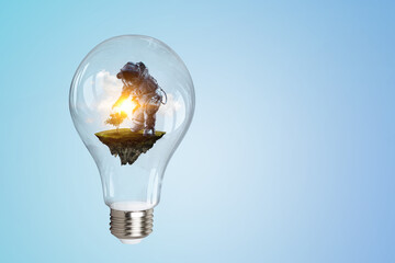 Wall Mural - spaceman inside light bulb . mixed media
