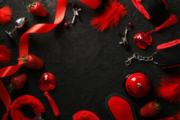 Wall Mural - A collection of sex toys on a dark background.