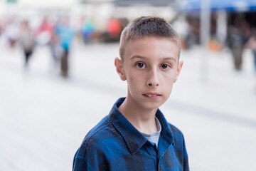 portrait of a boy outdoor on a city street